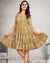 Woman wearing mustard floral cotton short dress with tiered fit and flare