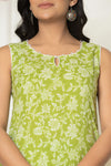 Close-up of lime green floral cotton kurta keyhole neckline and piping detail