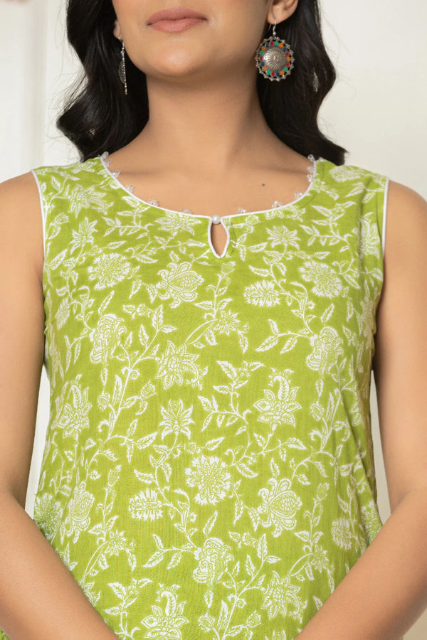 Close-up of lime green floral cotton kurta keyhole neckline and piping detail