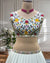 Designer white embroidered lehenga choli set with dupatta displayed on mannequin